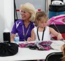 Ida sits with Ella, the daughter of one of our sponsors.
